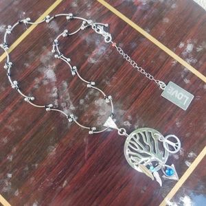 Handcrafted tree of Life necklace stamped with love... The feathers, blue charm,